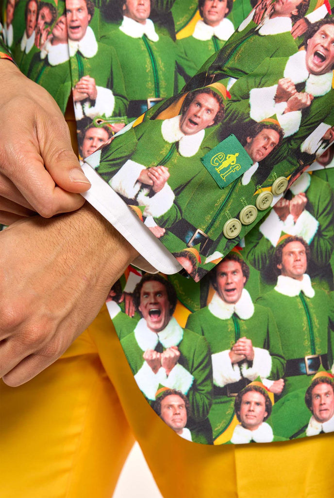 Man wearing men's Christmas suit with the character ELF on the jacket and yellow pants, close up