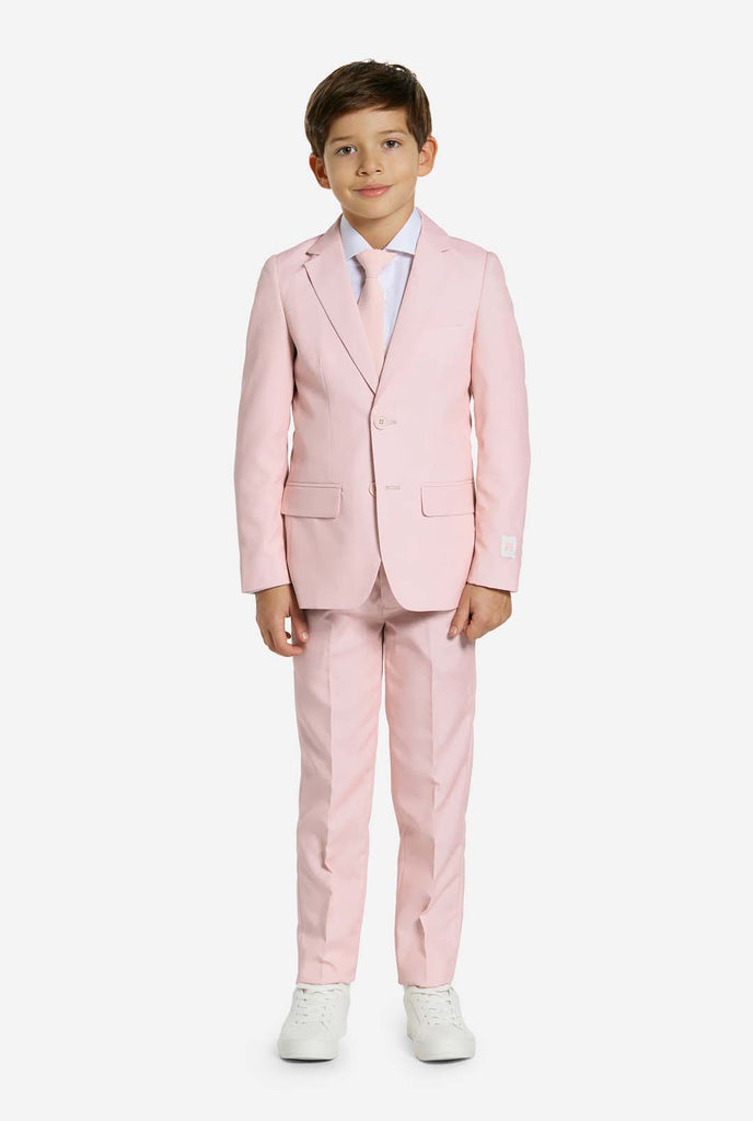 Kid wearing soft pink boys suit.