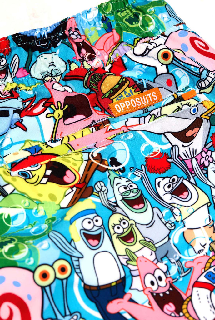 Man wearing swim trunks with SpongeBob print, close up