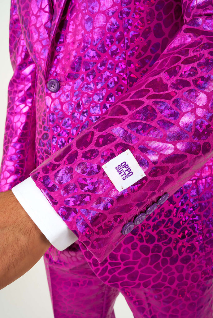 Man wearing shiny pink lizard skin men's suit, close up