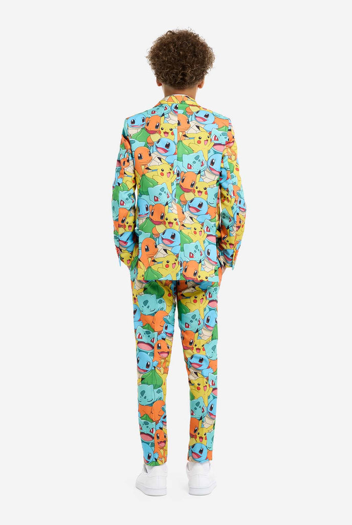 Teen wearing formal multi color suits with Pokemon print, view from the back