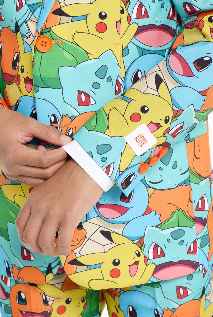 Teen wearing formal multi color suits with Pokemon print, close up