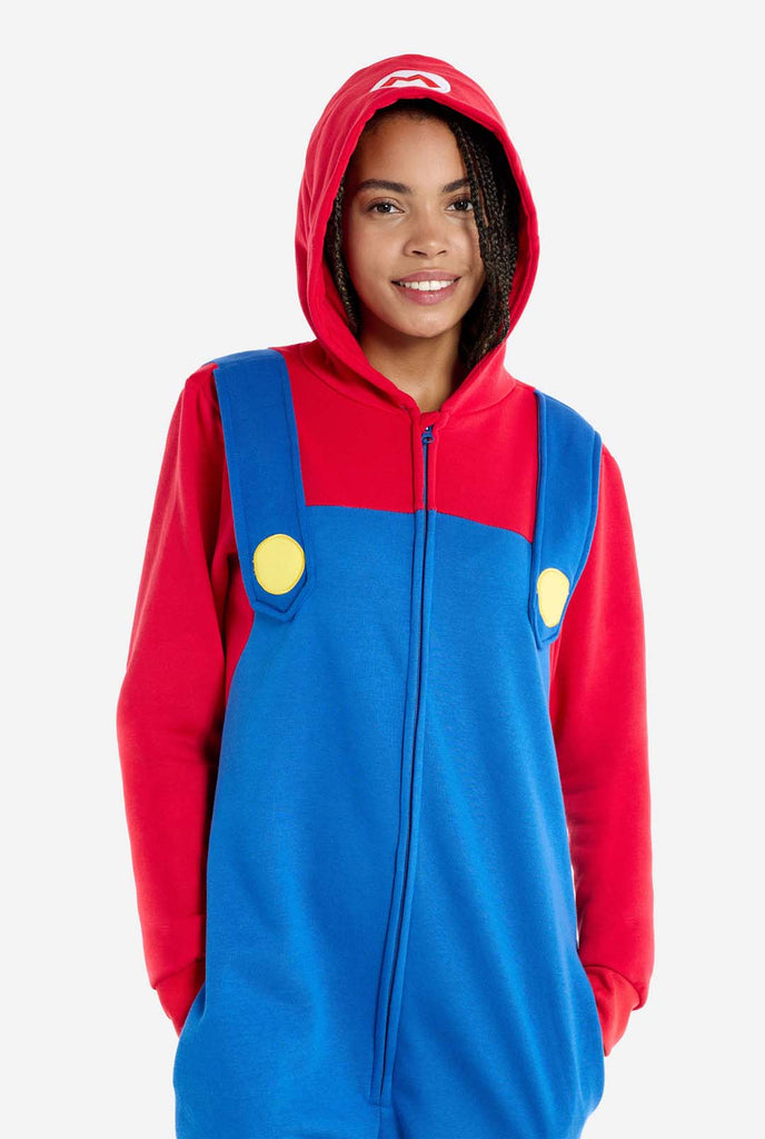 Woman wearing Unisex Adult Onesie with Super Mario theme