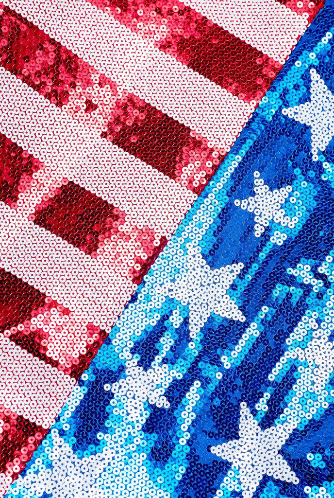 Image with white background and USA flag-colored red, blue, and white sequins blazer and white shirt. Close up. Close-up from the backside 