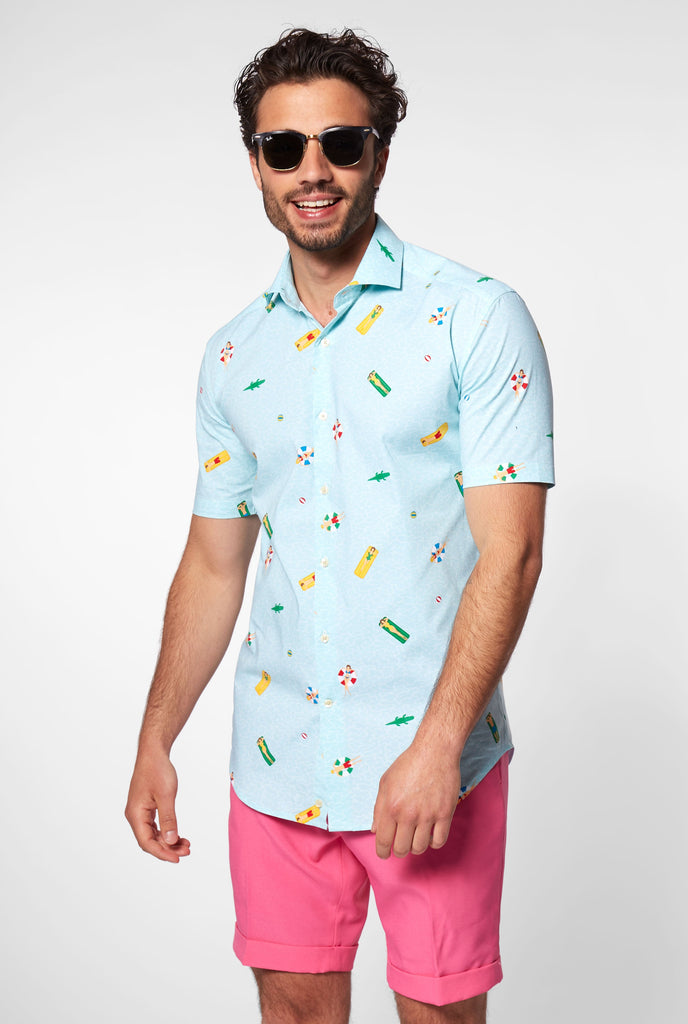 Man wearing light blue short sleeve shirt with pool icons