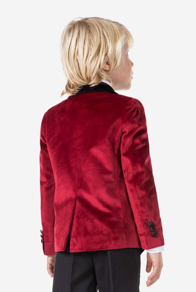 Boy wearing red velvet dinner jacket