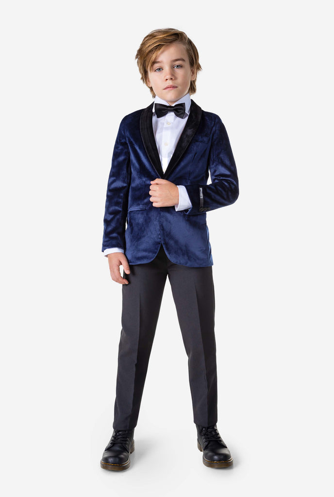 Boy wearing blue velvet Christmas dinner jacket