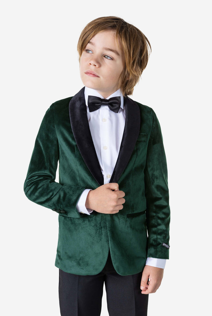 Boy wearing green velvet Christmas dinner jacket