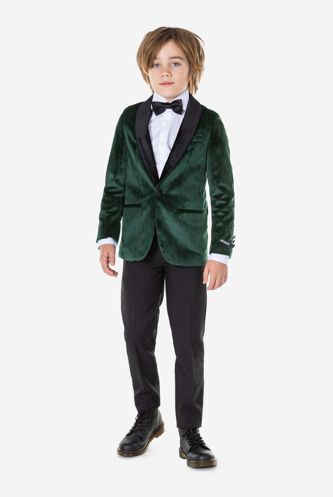 Boy wearing green velvet Christmas dinner jacket