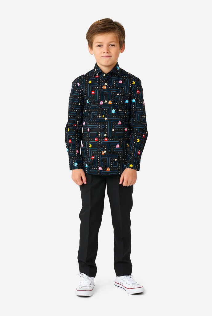 Boy wearing long sleeve boys' shirt with Pac-Man print