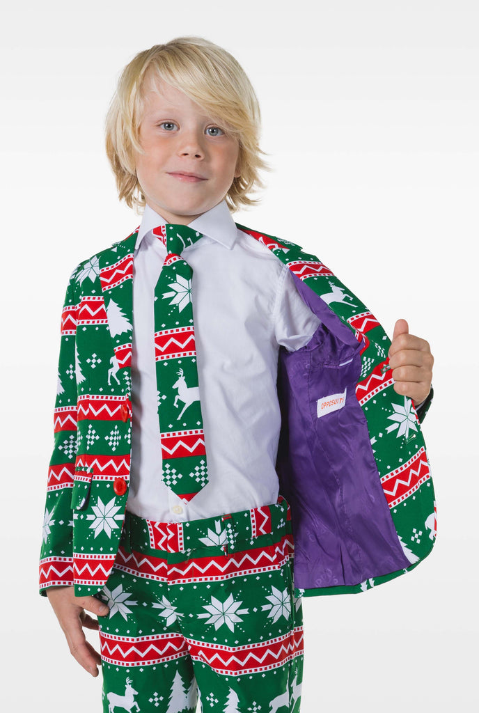 Kid wearing green Christmas suit