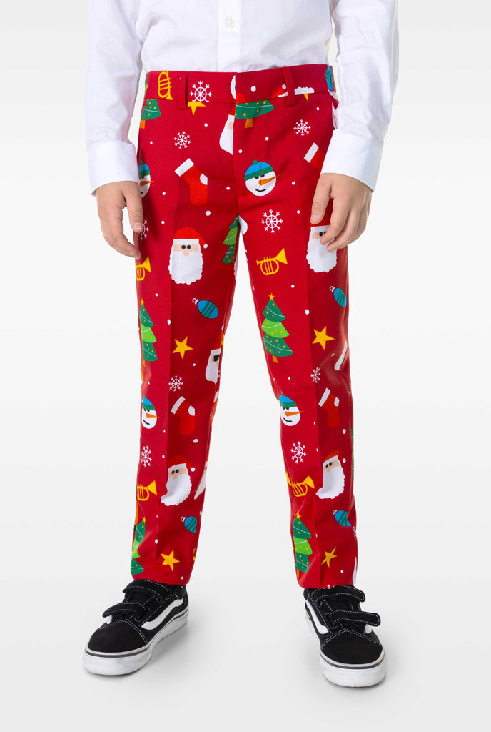 Kid wearing red Christmas suit with Christmas icons, pants close up