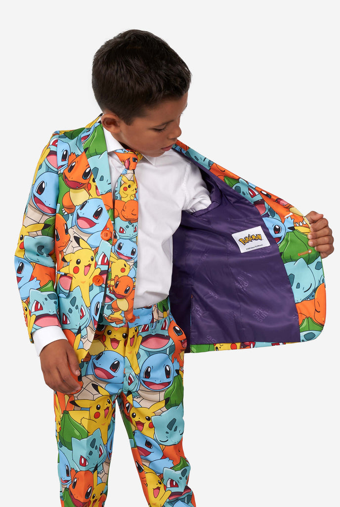 Boy wearing pokemon print suit