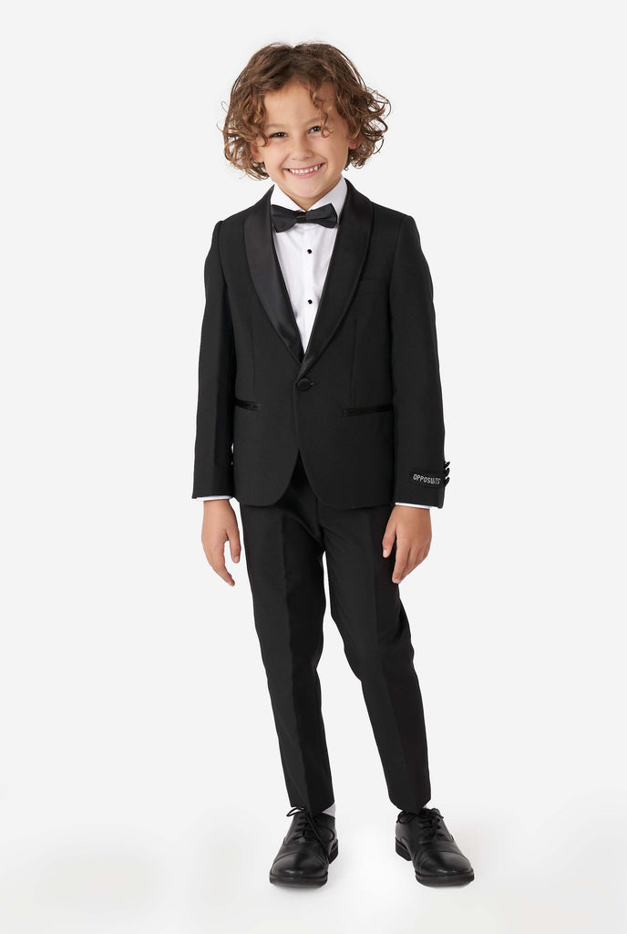 Kid wearing black tuxedo