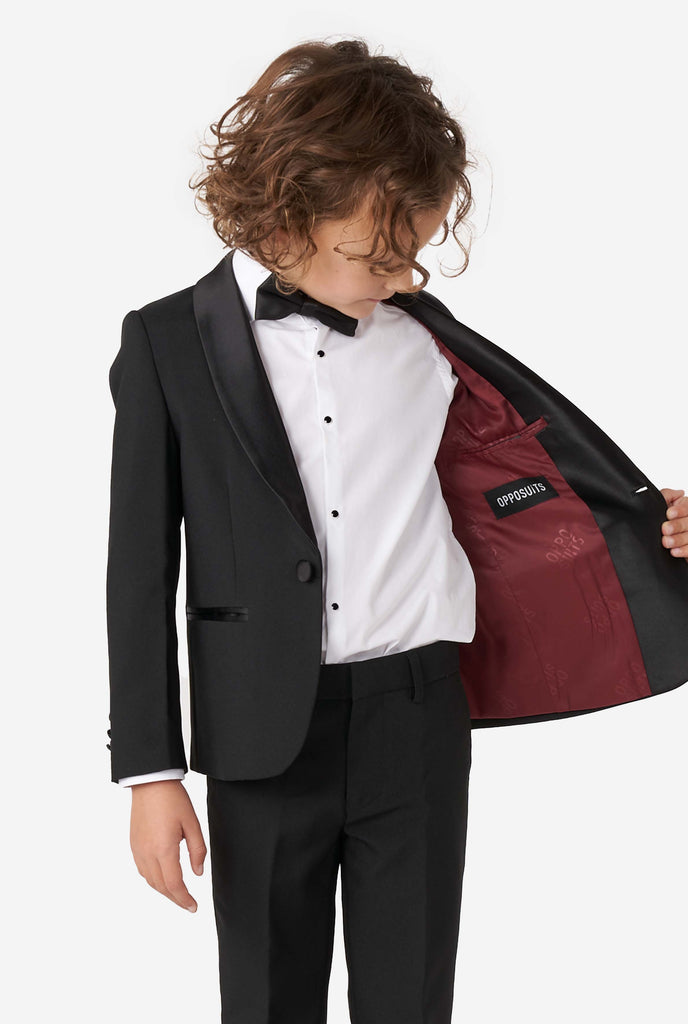 Kid wearing black tuxedo