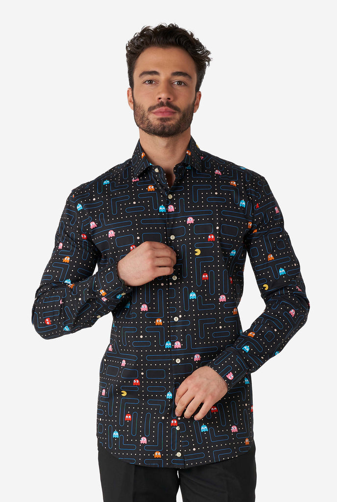 Man wearing black dress shirt with Pac-Man print