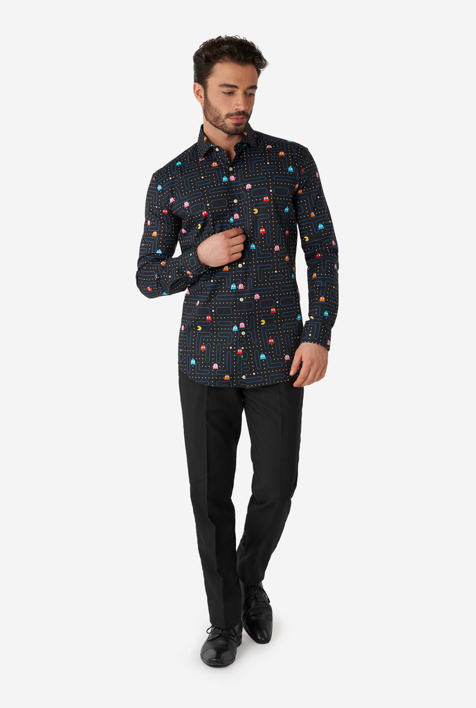 Man wearing black dress shirt with Pac-Man print