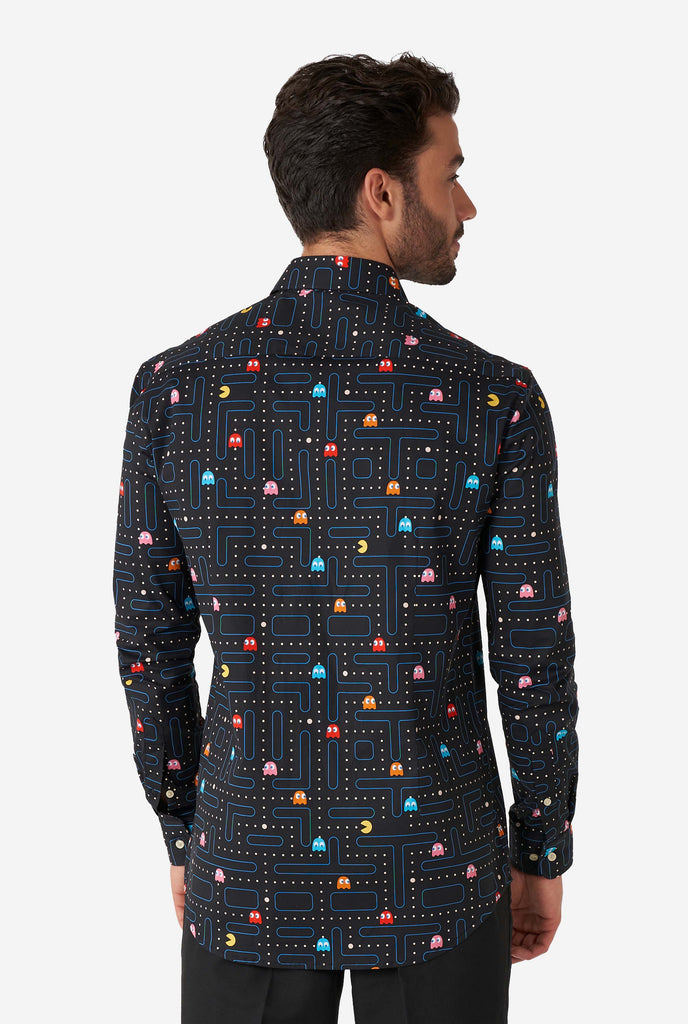 Man wearing black dress shirt with Pac-Man print, view from the back