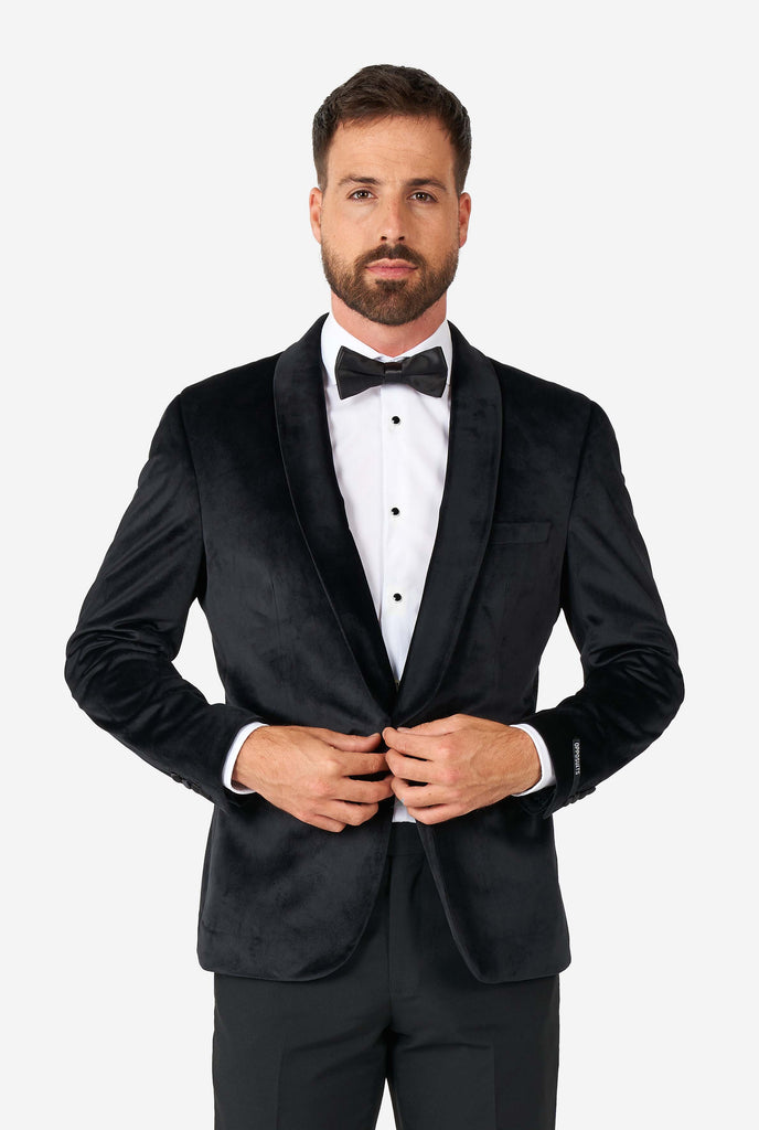 Man wearing black velvet dinner jacket blazer