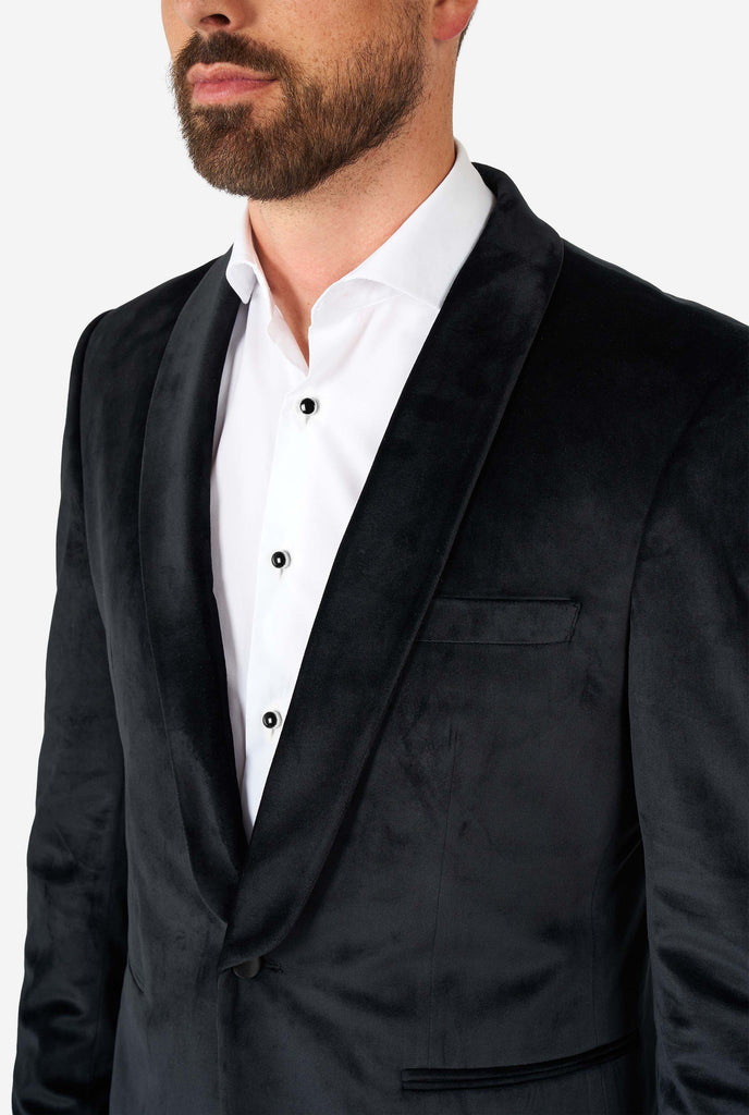 Man wearing black velvet dinner jacket blazer, close up