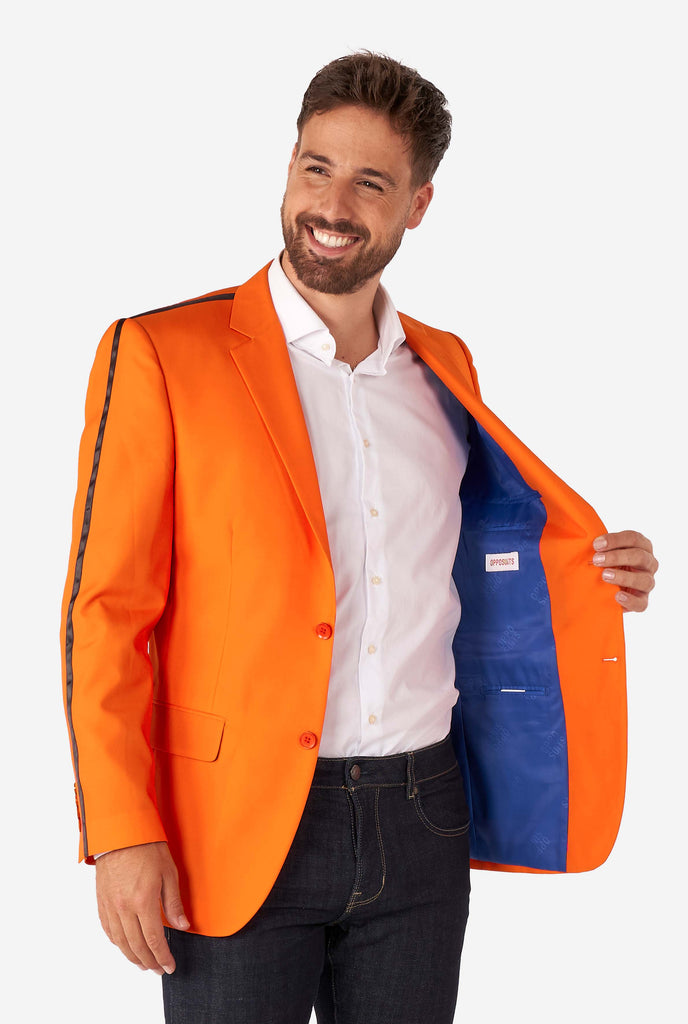 Man wearing orange blazer with dutch lion