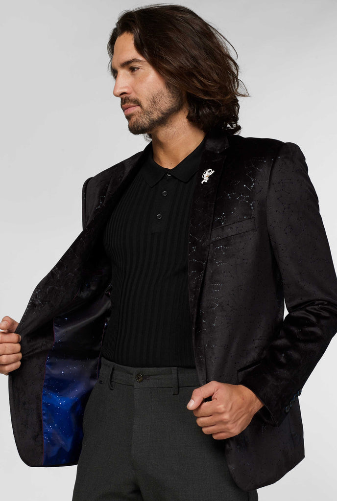 Black jacket with constellation pattern worn by a man showing galaxy inside of the jacket