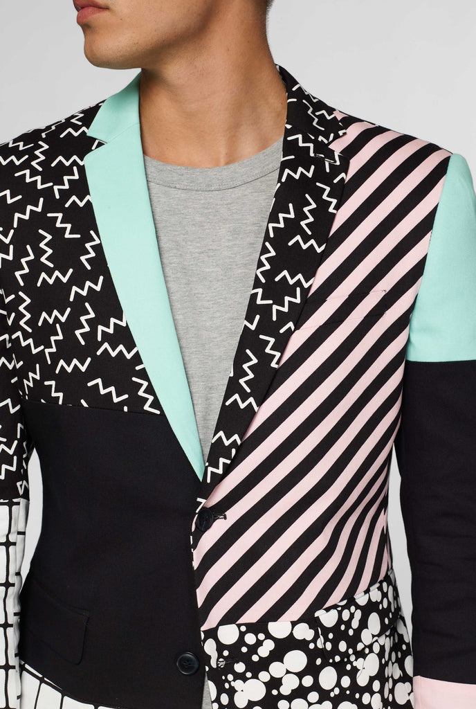 abstract pattern casual blazer inspired by Memphis group worn by man up close