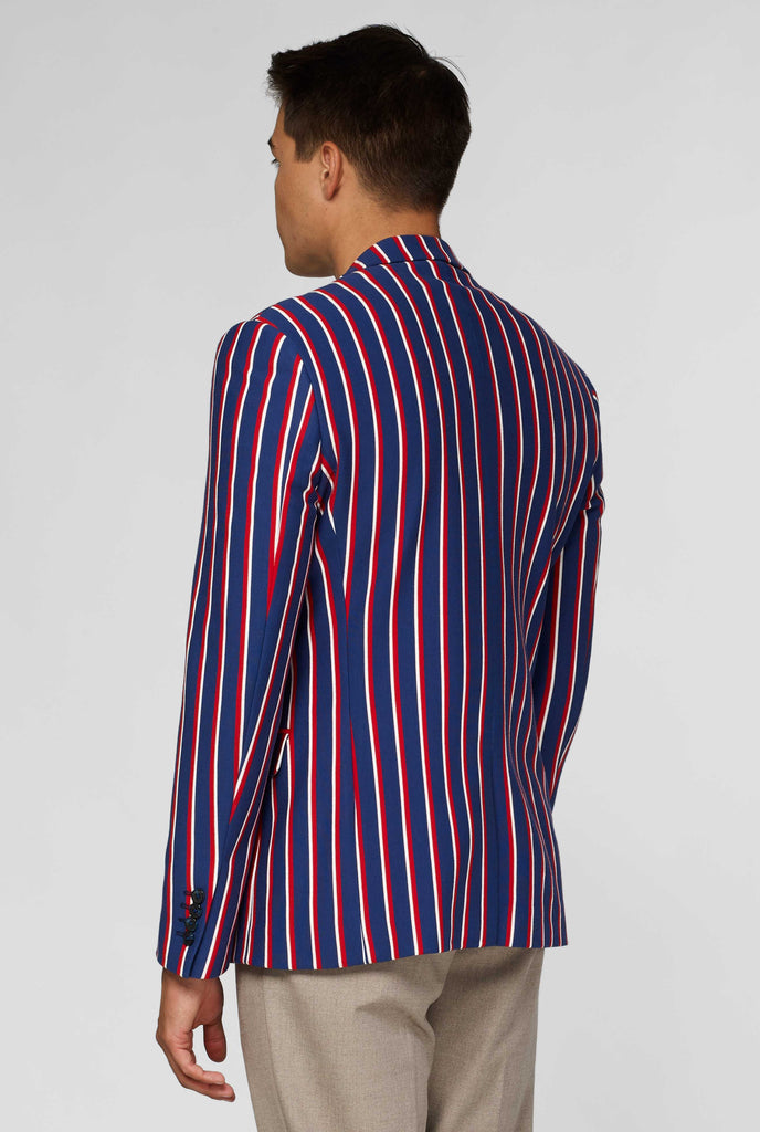 Red white and blue striped casual blazer worn by man shown from behind