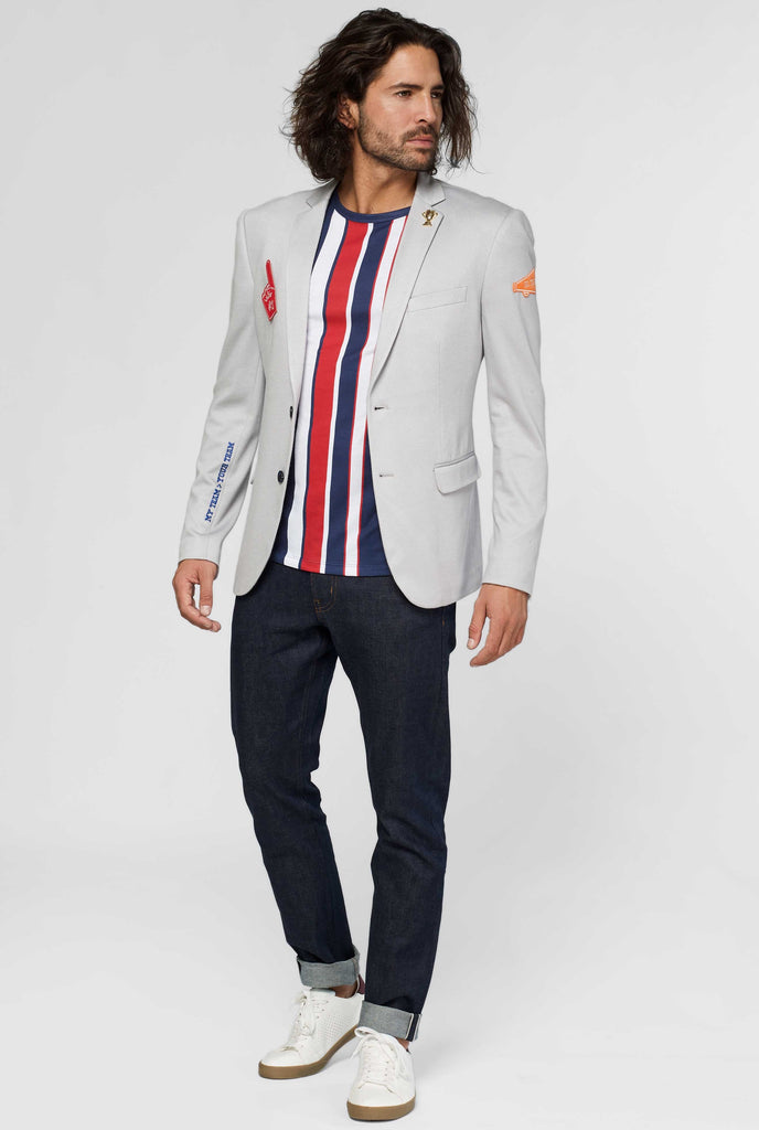 Grey sportswear casual blazer with sports patches worn by man