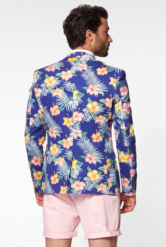 Blue blazer with flower print worn by man showing back of blazer