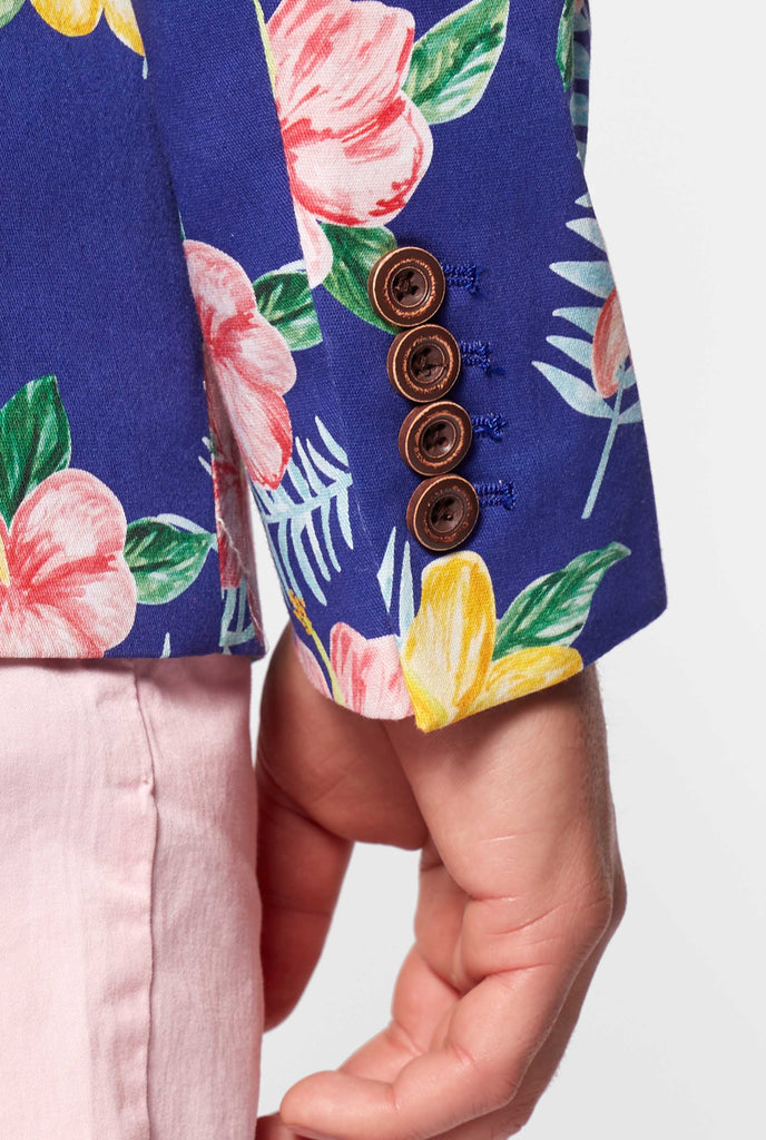 Blue blazer with flower print worn by man close up of sleeve