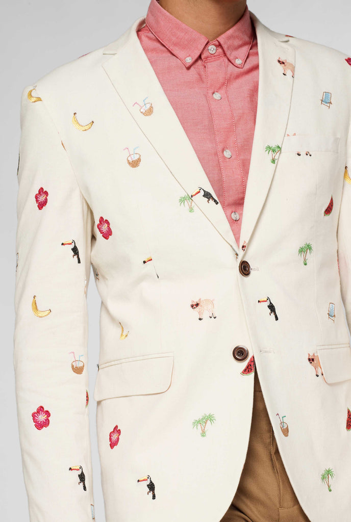 Off-white blazer with tropical embroidery worn by man shown up close