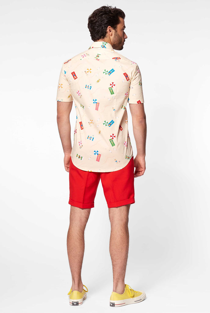 Man wearing summer shirt with beach icons, view from the back