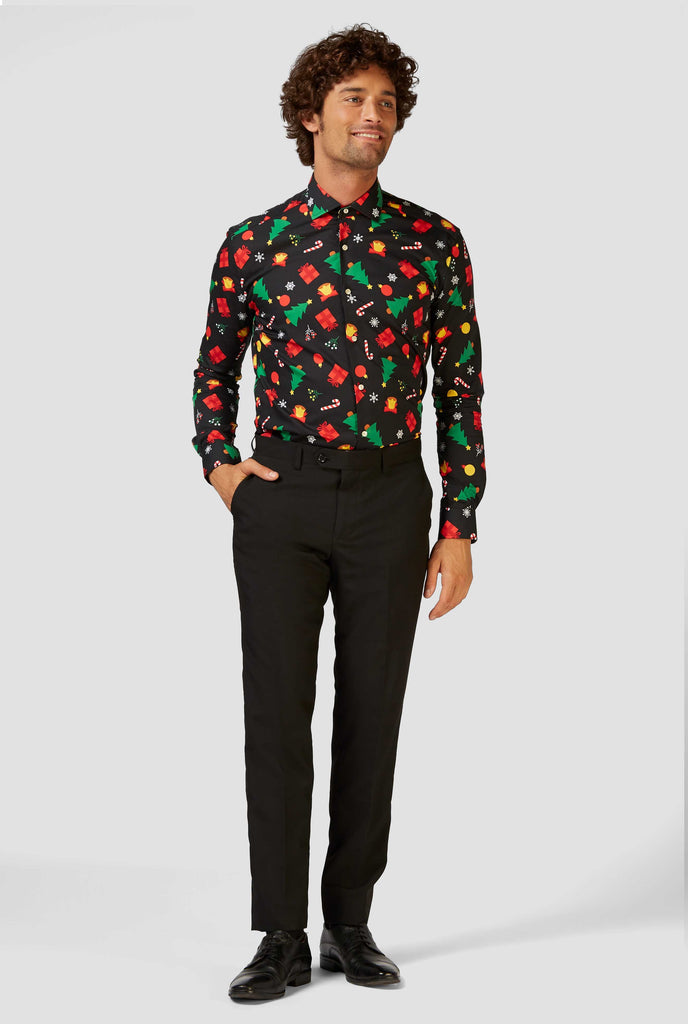 Man wearing black dress shirt with Christmas icons