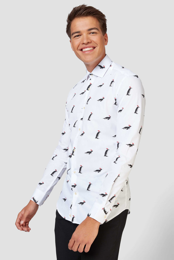 Man wearing white dress shirt with Christmas penguins