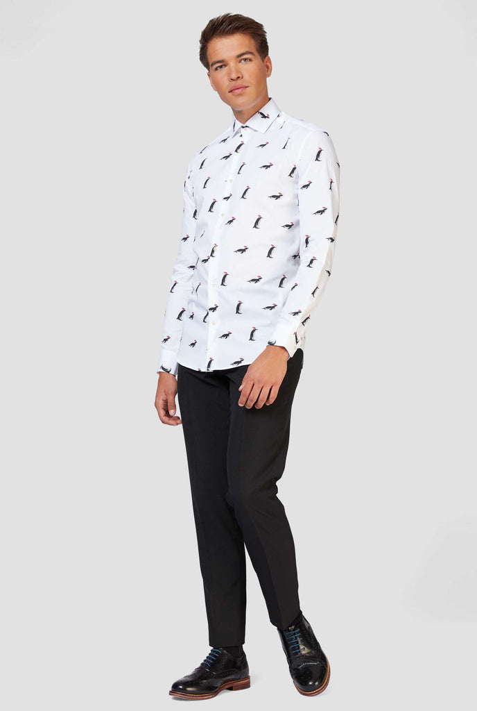 Man wearing white dress shirt with Christmas penguins