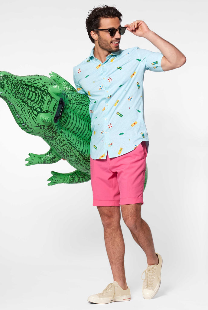 Man wearing summer shirt with pool icons