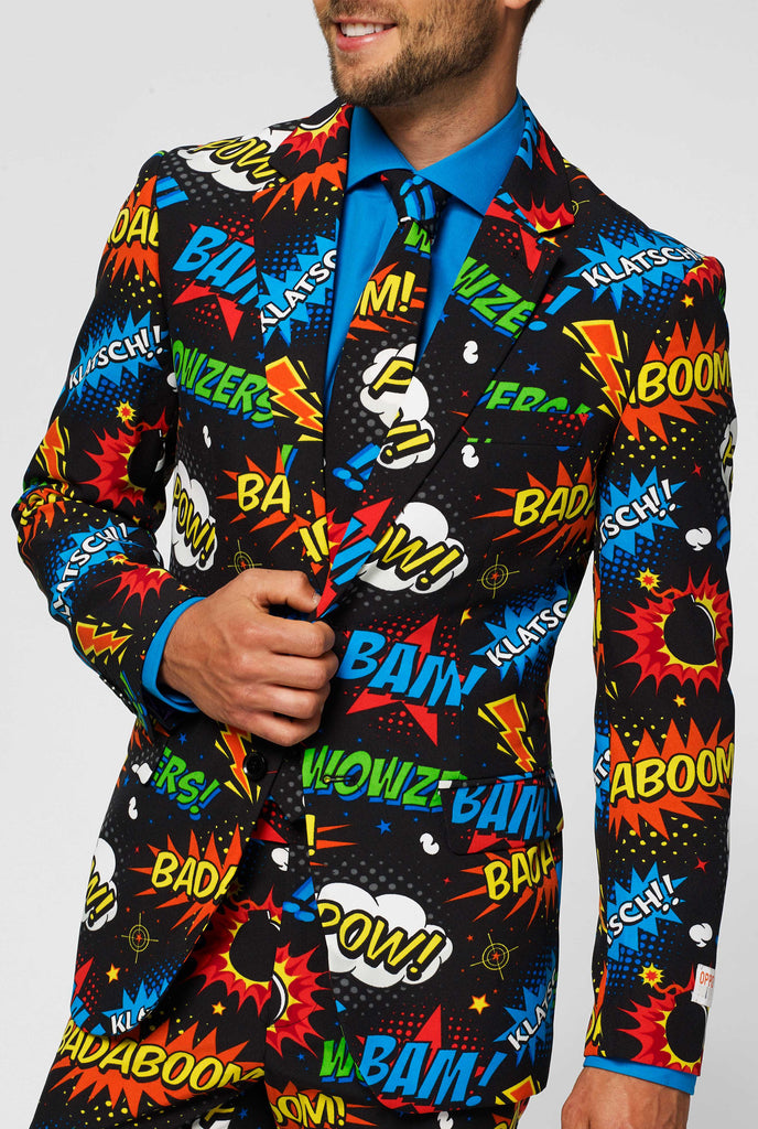 Black suit with comic book icons worn by man jacket up close