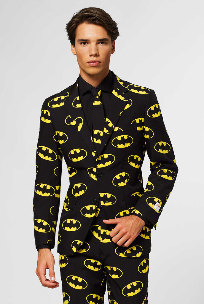 Black men's suit with Batman logos print worn by man