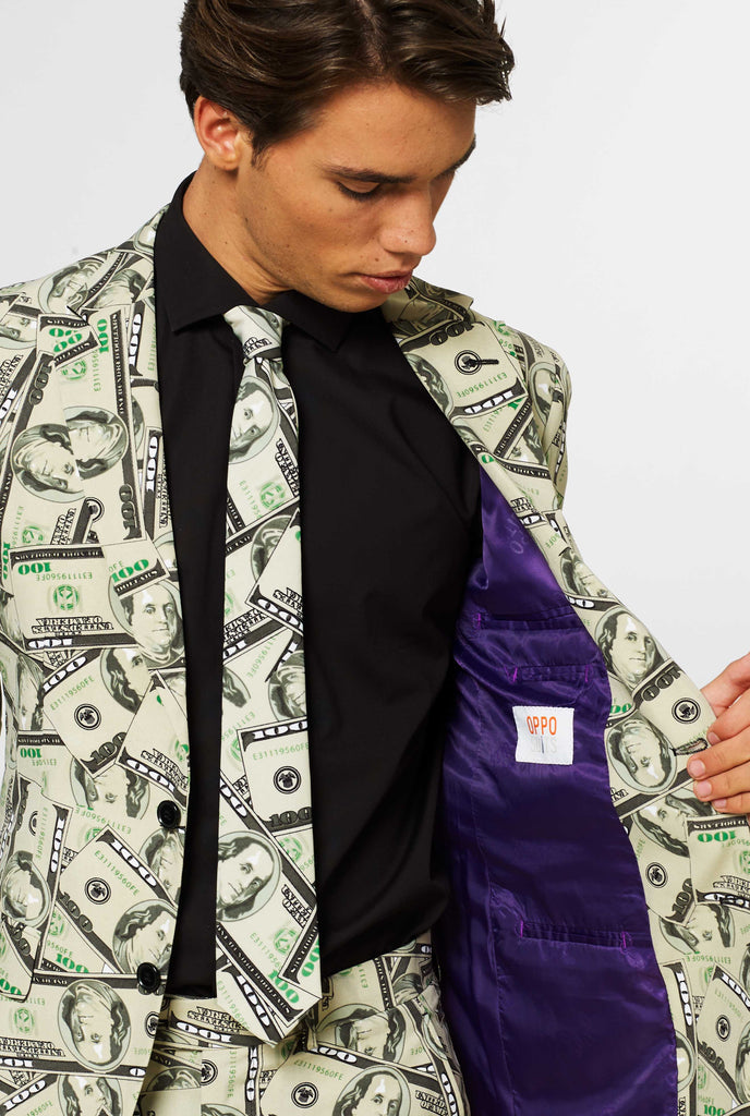 Man wearing men's suit with dollar, money print, close up