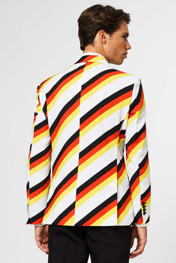 Man wearing German flag colored suit, view from the back