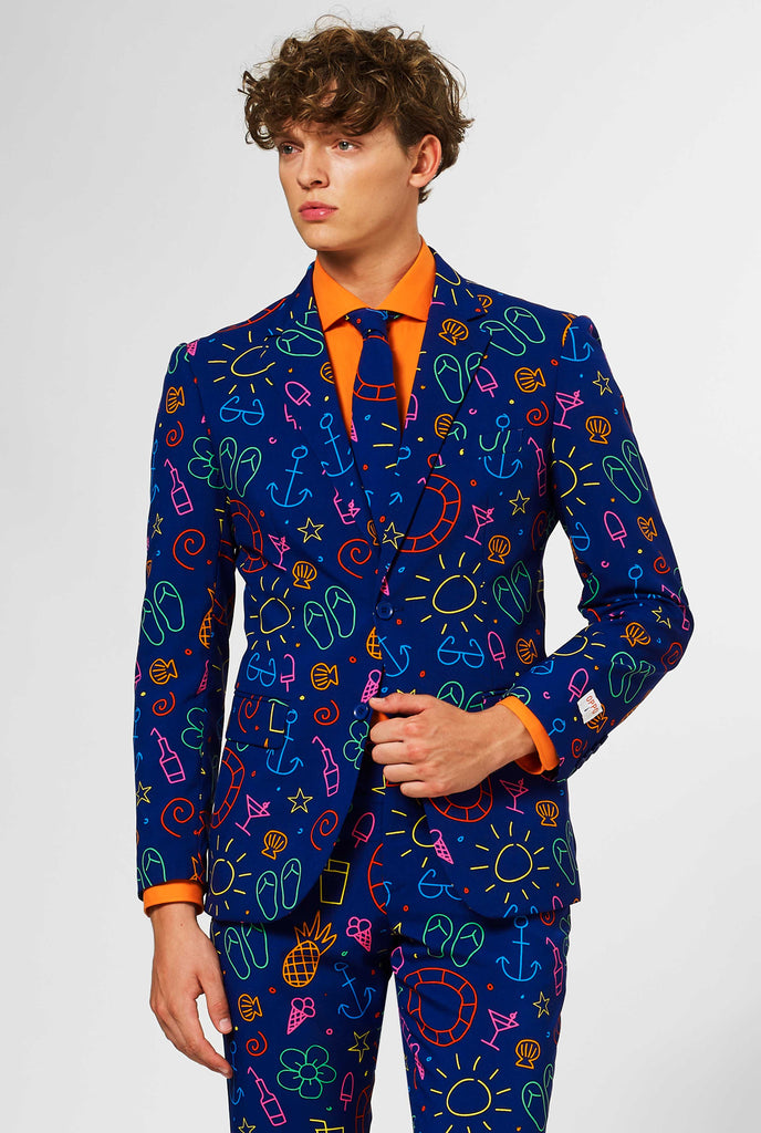 Dark blue men's  suit with bright doodle iconography worn by man