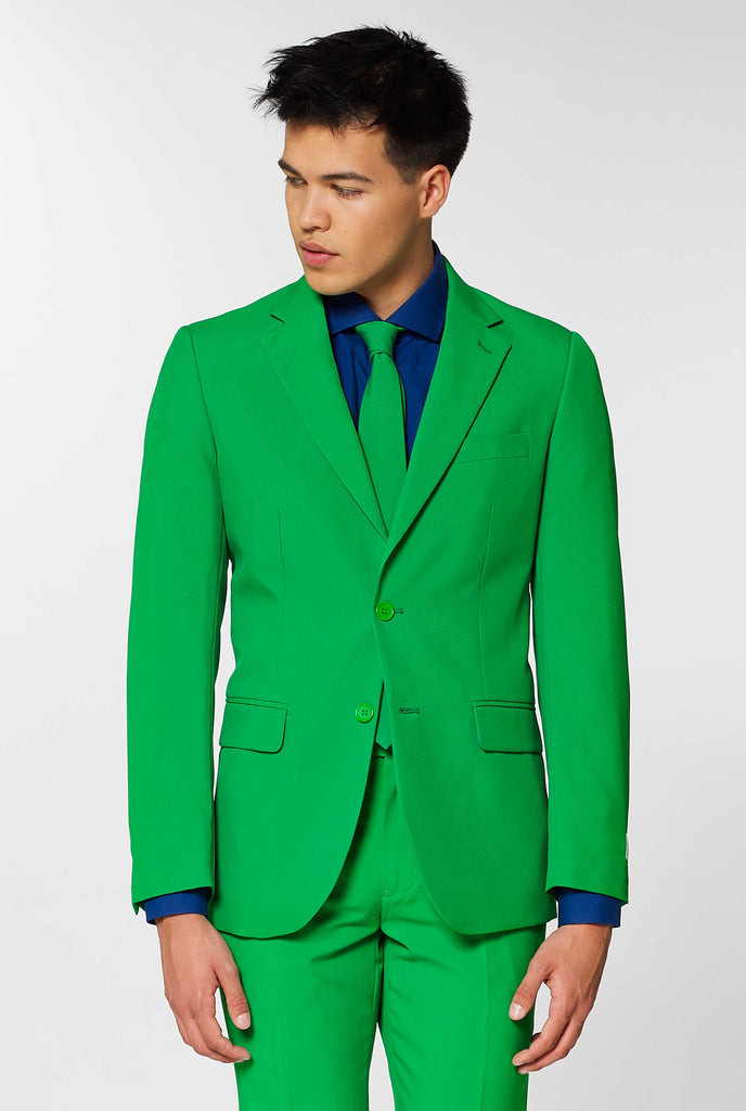 Man wearing green men's suit and dark blue dress shirt