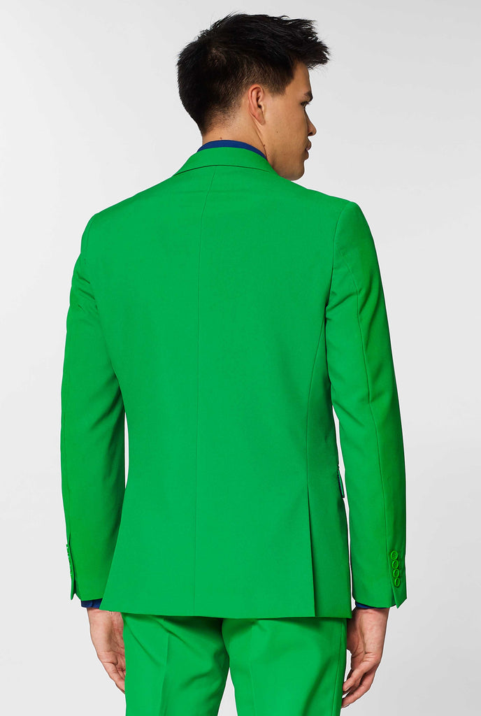 Man wearing green men's suit and dark blue dress shirt, view from the back