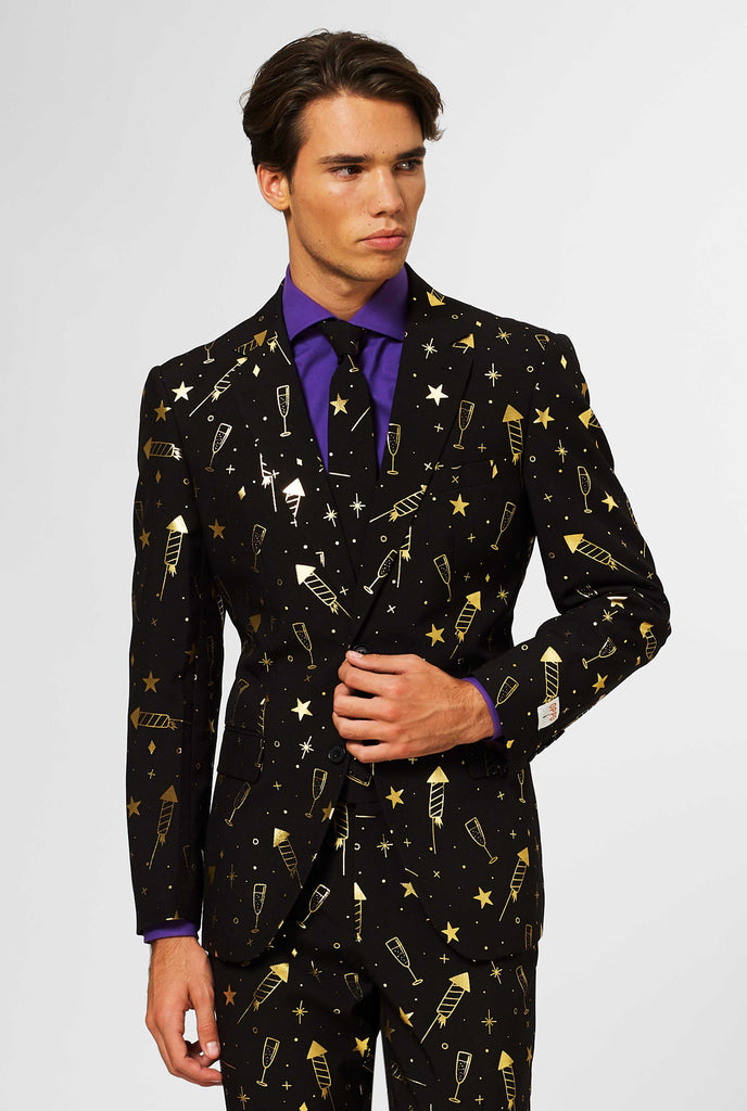 Black men's suit with golden fireworks print worn by man