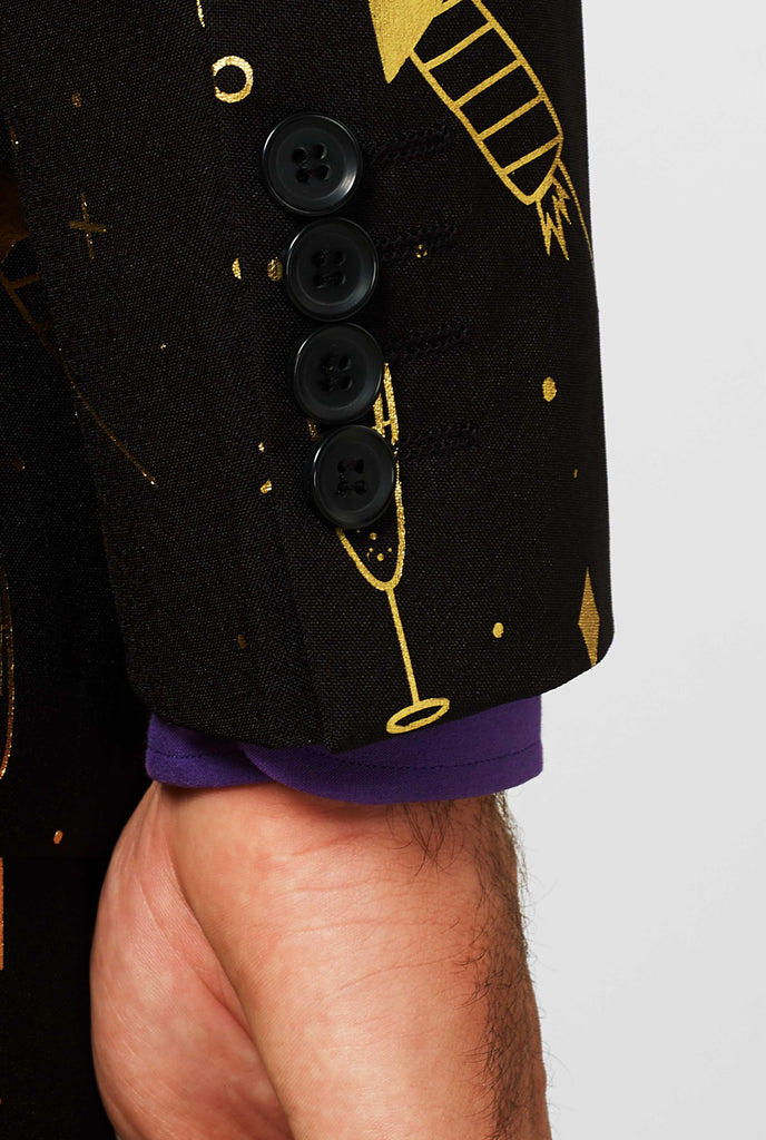 Black suit sleeve with golden fireworks print worn by man