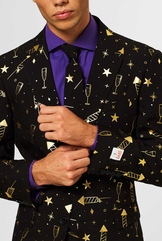 Black New Years Eve men's suit with golden fireworks print worn by man