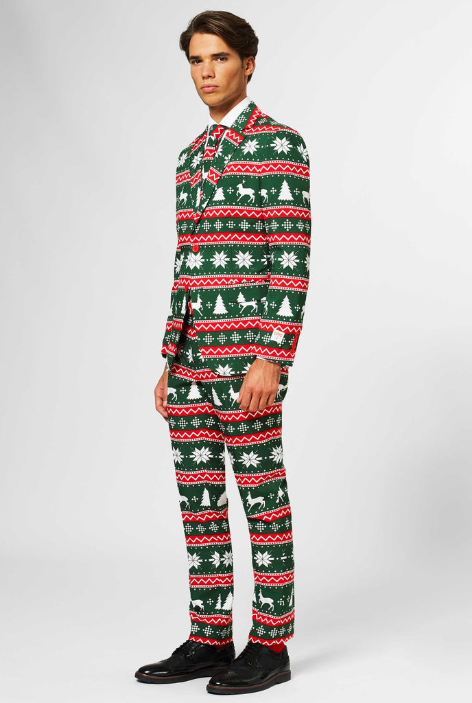 Green and red Christmas themed men's suit worn by man