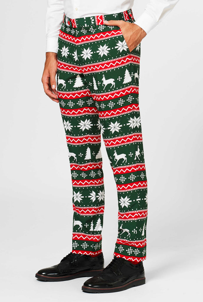 Green and red Christmas themed pants worn by man