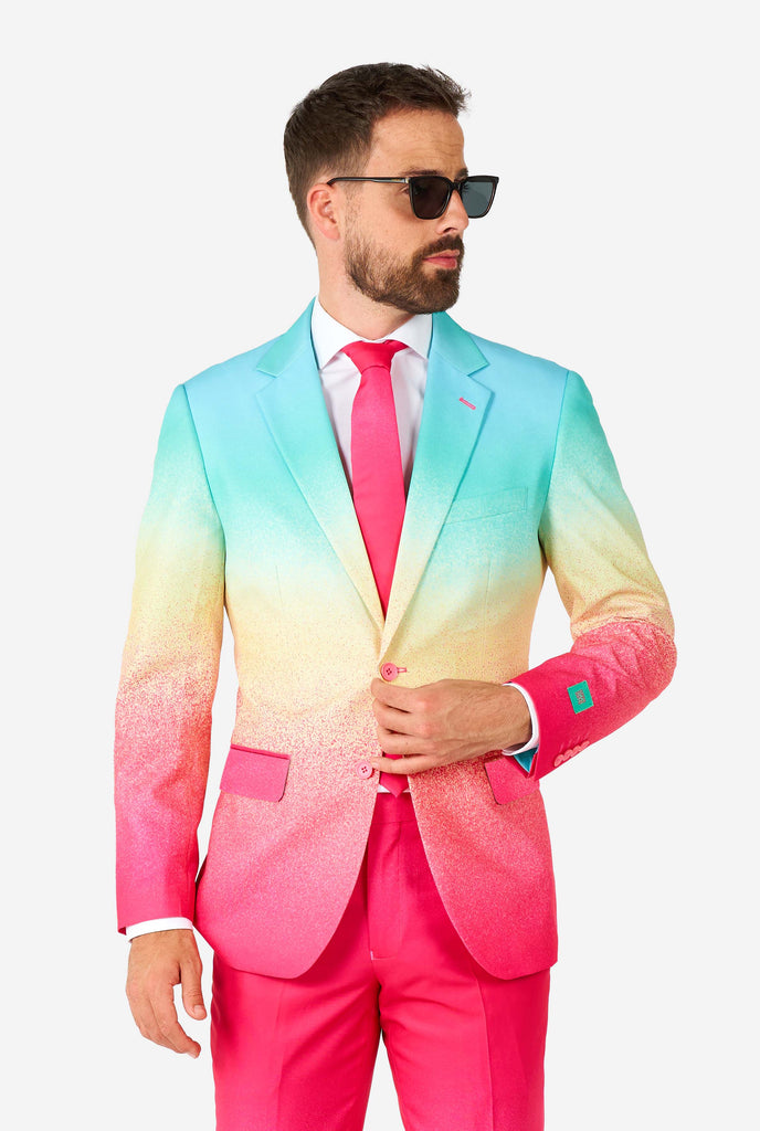Man wearing rainbow colored suit